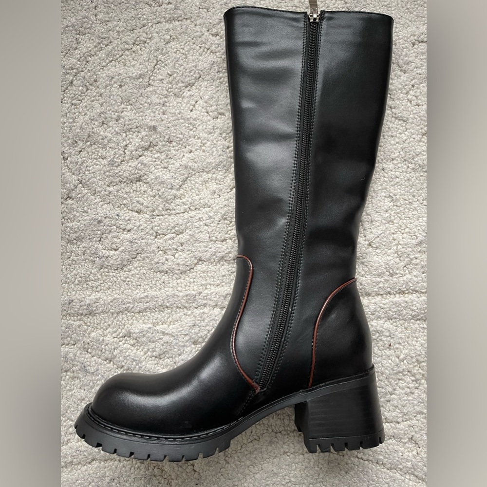 Genuine leather black knee high boots.